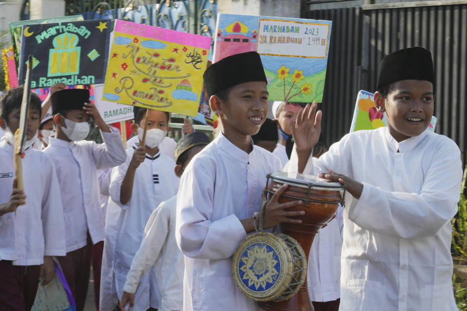 Indonesian students march during a parade ahead of Ramadan in Jakarta, Indonesia, Tuesday, March 21, 2023. Ramadan, the holy fasting month, is expected to begin on Thursday. Indonesia is the world's most populous Muslim nation. (AP Photo/Achmad Ibrahim)