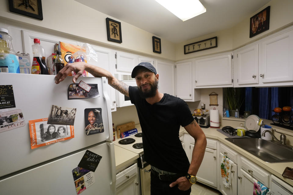 Richard Coleman II poses in his home in Richmond, Va., Thursday, Feb. 11, 2021. Coleman said he was asked to leave four jobs and was taken out of the running for at least six others because of his convictions for possessing a fraction of an ounce of marijuana, once as a college student in 2003 and a second time a few years later. (AP Photo/Steve Helber)