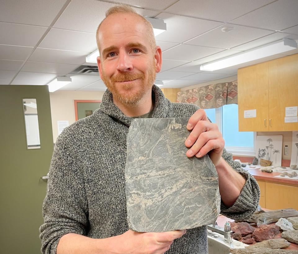 CBU geology instructor Jason Loxton, who is also curator of the Cape Breton Fossil Centre in Sydney Mines, holds up a fossil specimen at the museum in this file photo.