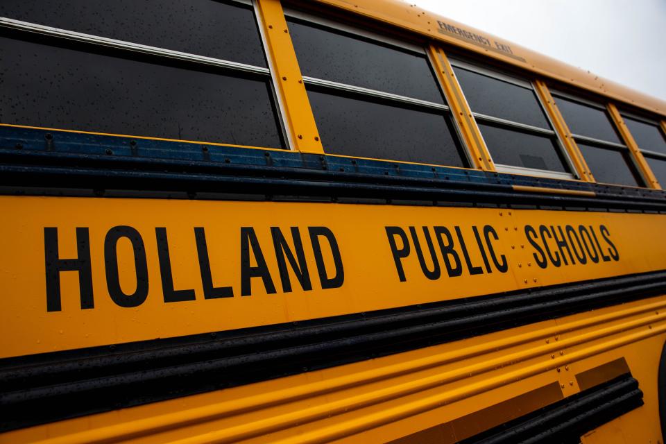 A Holland Public School bus sits in the parking lot outside Holland High School Tuesday, Sept. 21, 2021 located at 600 Van Raalte Ave. in Holland. 