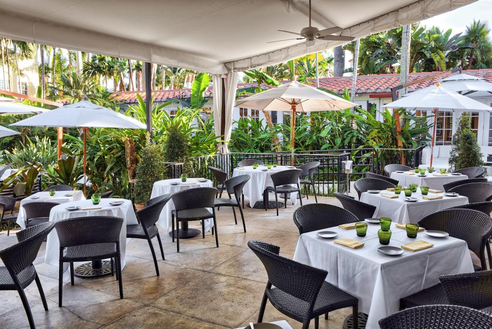 Guests dine at the terrace in Café Boulud at the Brazilian Court Hotel.