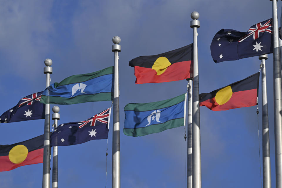 The Australian flag, the Indigenous flag and the flag of the Torres Strait Islands fly outside Parliament House in Canberra, June 1, 2023. FIFA President Gianni Infantino confirmed the decision on Friday, July 7, 2023, that First Nations flags will be flown at Women's World Cup stadiums in Australia and New Zealand after soccer's world governing body agreed to make exceptions to the usually tight FIFA match day regulations for tournament venues. (Mick Tsikas/AAP Image via AP)