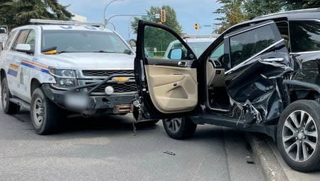 RCMP say the car fled a traffic stop and rammed an RCMP cruiser. Shots were fired at officers before the occupants were arrested, according to police. One of the officers involved in the arrest has been charged with assault.