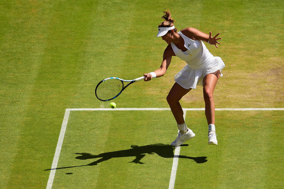 LONDON, ENGLAND - JULY 11:  Garbine Muguruza of Spain plays a forehand in the Final Of The Ladies' Singles against Serena Williams of the United States during day twelve of the Wimbledon Lawn Tennis Championships at the All England Lawn Tennis and Croquet Club on July 11, 2015 in London, England.  (Photo by Shaun Botterill/Getty Images)