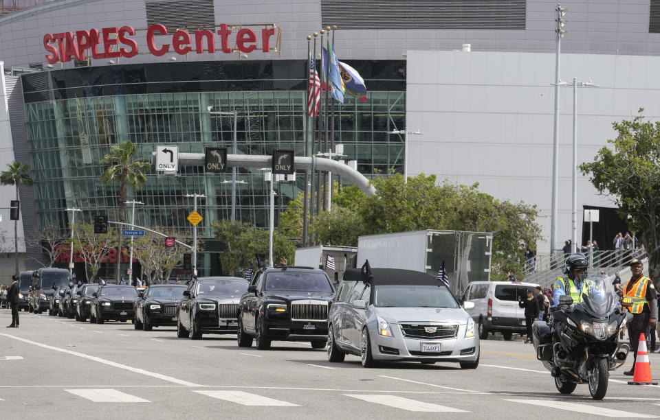 The hearse carrying rapper Nipsey Hussle leaves Staples Center after a memorial service in Los Angeles, Thursday, April 11, 2019. Hussle was killed in a shooting outside his Marathon Clothing store in south Los Angeles on March 31. (AP Photo/Ringo H.W. Chiu)