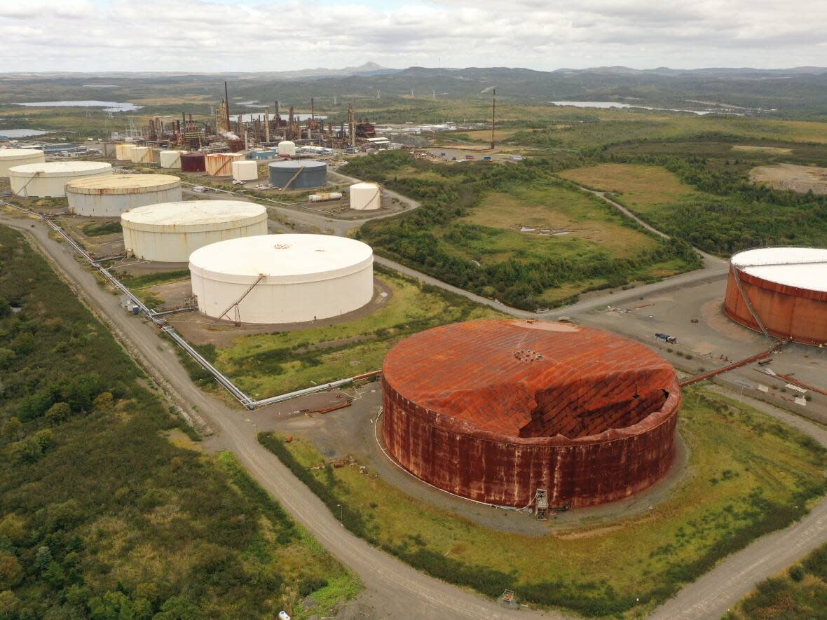 The Come By Chance oil refinery site is pictured in a September file image. The owners have said that Tank 106, in the foreground, does not pose an environmental concern. Government officials have said the refinery has an on-site secondary containment system designed to capture and contain any product, if a tank should leak or fail. (CBC - image credit)