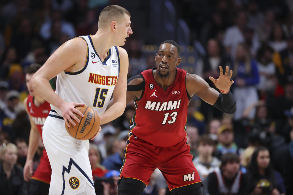 DENVER, CO - DECEMBER 30: Bam Adebayo #13 of the Miami Heat defends Nikola Jokic #15 of the Denver Nuggets during the first quarter at Ball Arena on December 30, 2022 in Denver, Colorado. NOTE TO USER: User expressly acknowledges and agrees that, by downloading and or using this photograph, user is consenting to the terms and conditions of Getty Images License Agreement. Mandatory Copyright Notice: Copyright 2022 NBAE (Photo by C. Morgan Engel/Getty Images)