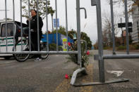 Flowers for victims of Tuesday's attack lay outside a police barricade on the bike path next to West Street a day after a man driving a rented pickup truck mowed down pedestrians and cyclists on a bike path alongside the Hudson River in New York City, in New York, U.S. November 1, 2017. REUTERS/Shannon Stapleton