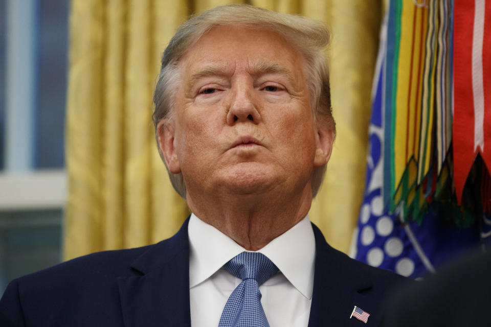 President Donald Trump stands during a ceremony to present the Presidential Medal of Freedom to former Attorney General Edwin Meese, in the Oval Office of the White House, Tuesday, Oct. 8, 2019, in Washington. (AP Photo/Alex Brandon)