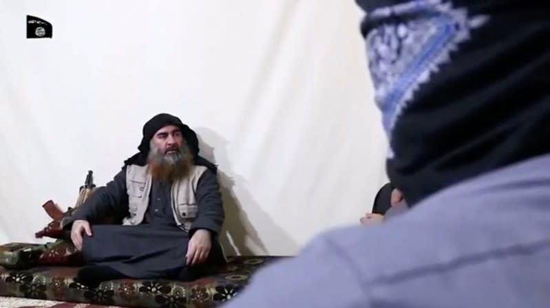 A bearded man with Islamic State leader Abu Bakr al-Baghdadi's appearance speaks in this screen grab taken from video