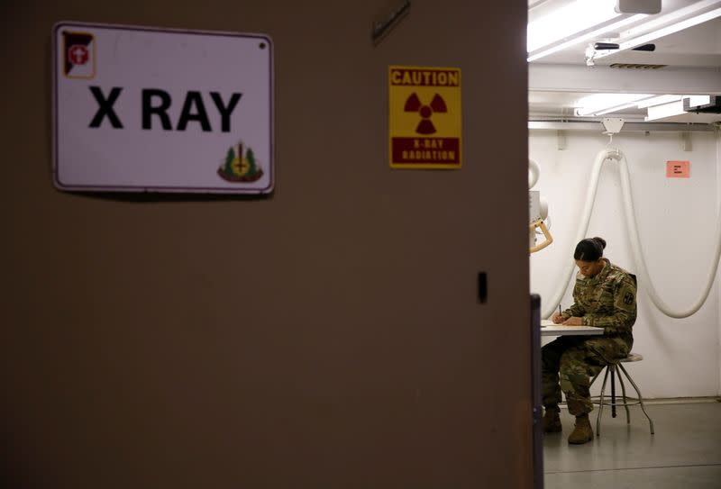 Staff sergeant Lambert of the U.S. Army works on a schedule inside the radiology unit at a military field hospital for non-coronavirus patients inside CenturyLink Field Event Center during the coronavirus disease (COVID-19) outbreak in Seattle