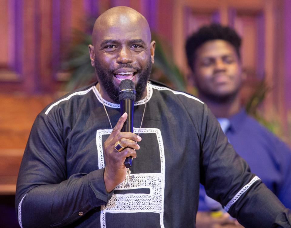 Pastor Carlos Perkins who has made education about mental health issues paramount at Bethel Cathedral AME, leads Sunday service in Indianapolis, Nov. 7, 2021. 