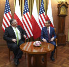 US Secretary of State Mike Pompeo, left, talks with Poland's Prime Minister Mateusz Morawiecki prior to a meeting at the Chancellery in Warsaw, Poland, Saturday Aug. 15, 2020. Pompeo is on a five day visit to central Europe. (Janek Skarzynski/Pool via AP)