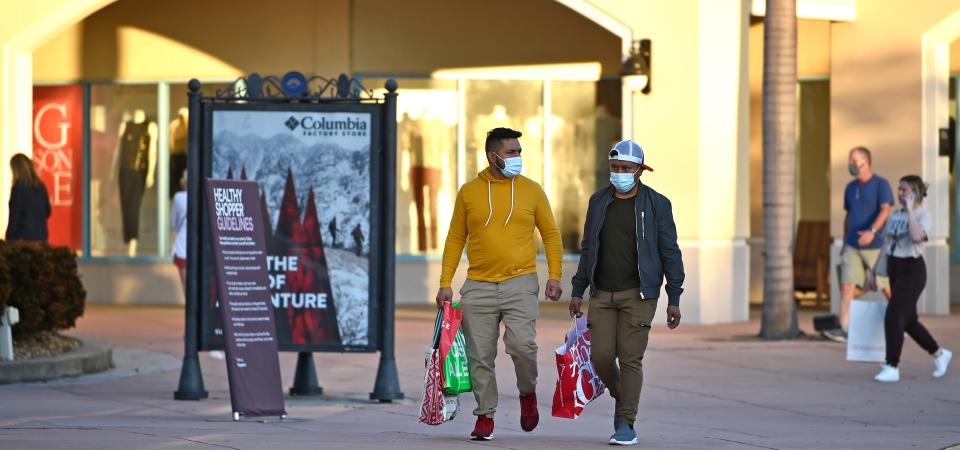 Shoppers load up on Black Friday deals last year at the Ellenton Premium Outlets.