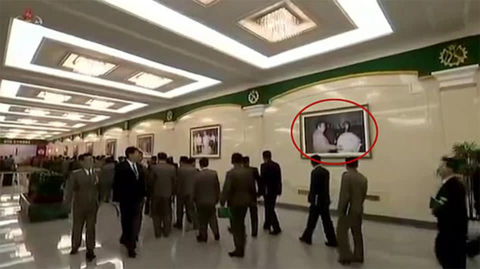 In a news broadcast, regulated by the rogue nation, a portrait shows what appears to be former leader Kim Jong-il inspecting an atomic bomb. Source: