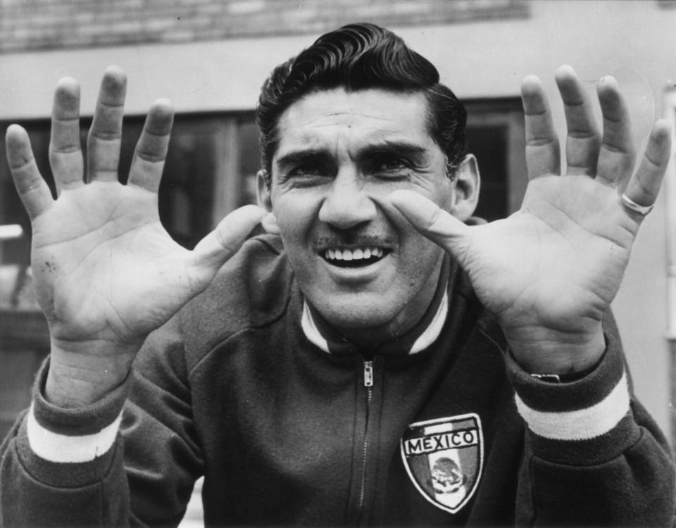 July 1966:  Antonio Carbajal, the Mexican goalkeeper, showing his injured left hand during a training session in Hertfordshire.  (Photo by Hulton Archive/Getty Images)