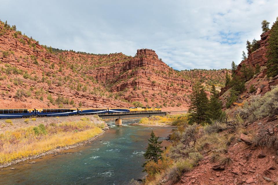 The Rocky Mountaineer going through the Rockies to the Red Rocks Red Canyon