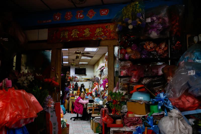 A shop owner looks onto the streets in Kinmen