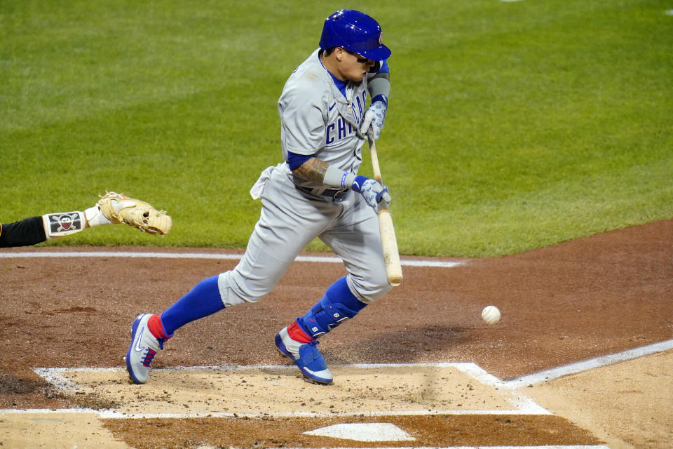 Chicago Cubs' Javier Baez drives in a run from third with a bunt single off Pittsburgh Pirates starting pitcher JT Brubaker during the second inning of a baseball game in Pittsburgh, Monday, Sept. 21, 2020. (AP Photo/Gene J. Puskar)