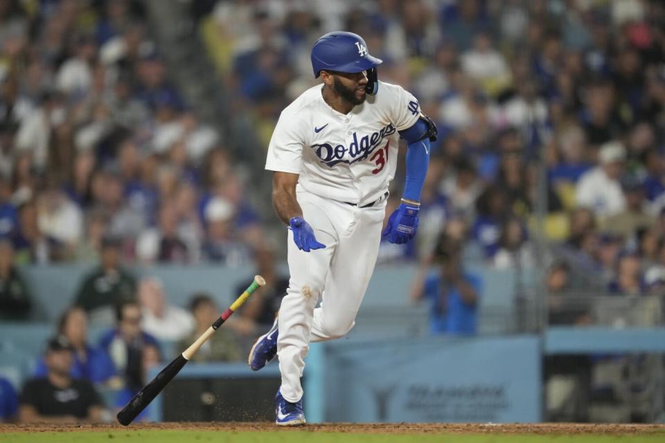 Amed Rosario singles during the seventh inning against the Cincinnati Reds on Friday.