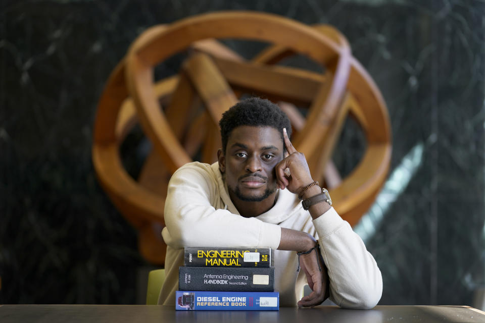 Illinois Institute of Technology student Wofai Ewa, originally from Nigeria, poses for a portrait Friday, Sept. 18, 2020, at the institute's library in Chicago. America was always considered the premiere destination for international students, with the promise of top-notch universities and work opportunities. Yet, 2016 marked the start of an alarming decline of new enrollees, something expected to continue with fresh rules limiting student visas, competition from other countries and a haphazard coronavirus response. (AP Photo/Charles Rex Arbogast)