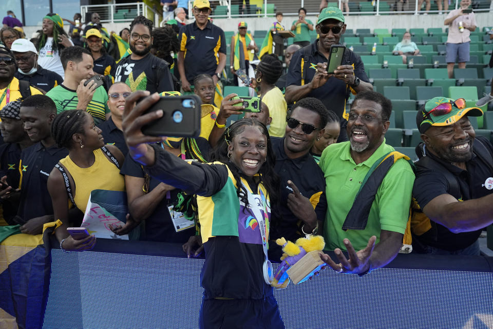 Shericka Jackson, of Jamaica, celebrates with fans after winning the final of the women's 200-meter run at the World Athletics Championships on Thursday, July 21, 2022, in Eugene, Ore. (AP Photo/David J. Phillip)