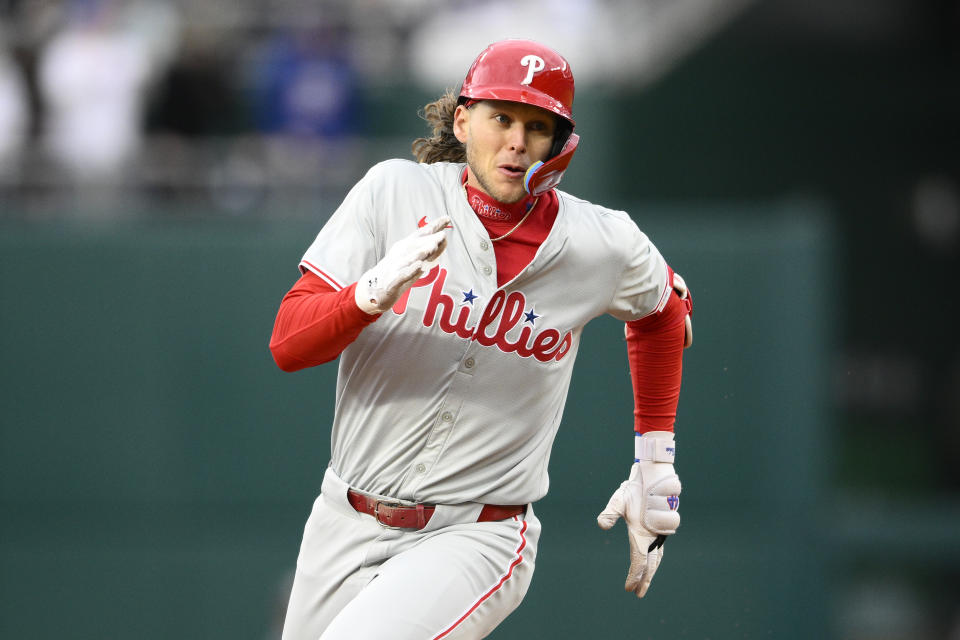 Philadelphia Phillies' Alec Bohm runs toward third base on his triple during the second inning of a baseball game against the Washington Nationals, Saturday, April 6, 2024, in Washington. (AP Photo/Nick Wass)