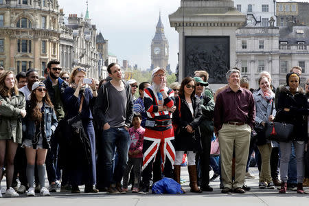 A man wearing a Union Flag outfit watches displays (not seen) in Trafalgar Square in London, Britain April 23, 2017. REUTERS/Kevin Coombs