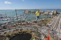 Nik Wallenda walks across a tightrope 200 feet above U.S. 41 on January 29, 2013 in Sarasota, Florida. (Photo by Tim Boyles/Getty Images)