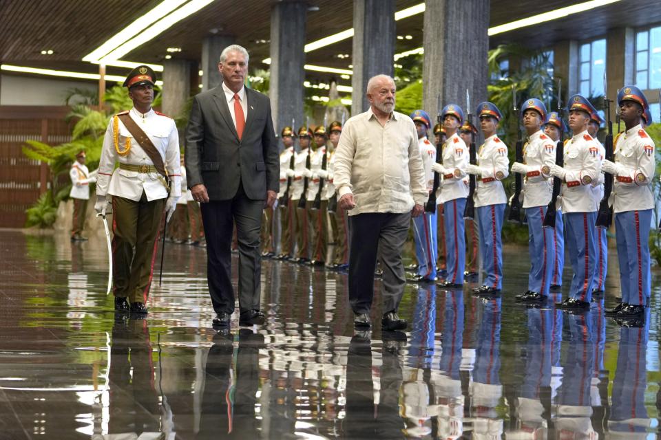 Cuban President Miguel Diaz-Canel, left, accompanies Brazilian President Luiz Inacio Lula da Silva during a visit to Revolution Palace, in Havana, Cuba, Saturday, Sept. 16, 2023. Lula is in Havana for the G77 + China summit. (AP Photo/Ramon Espinosa)