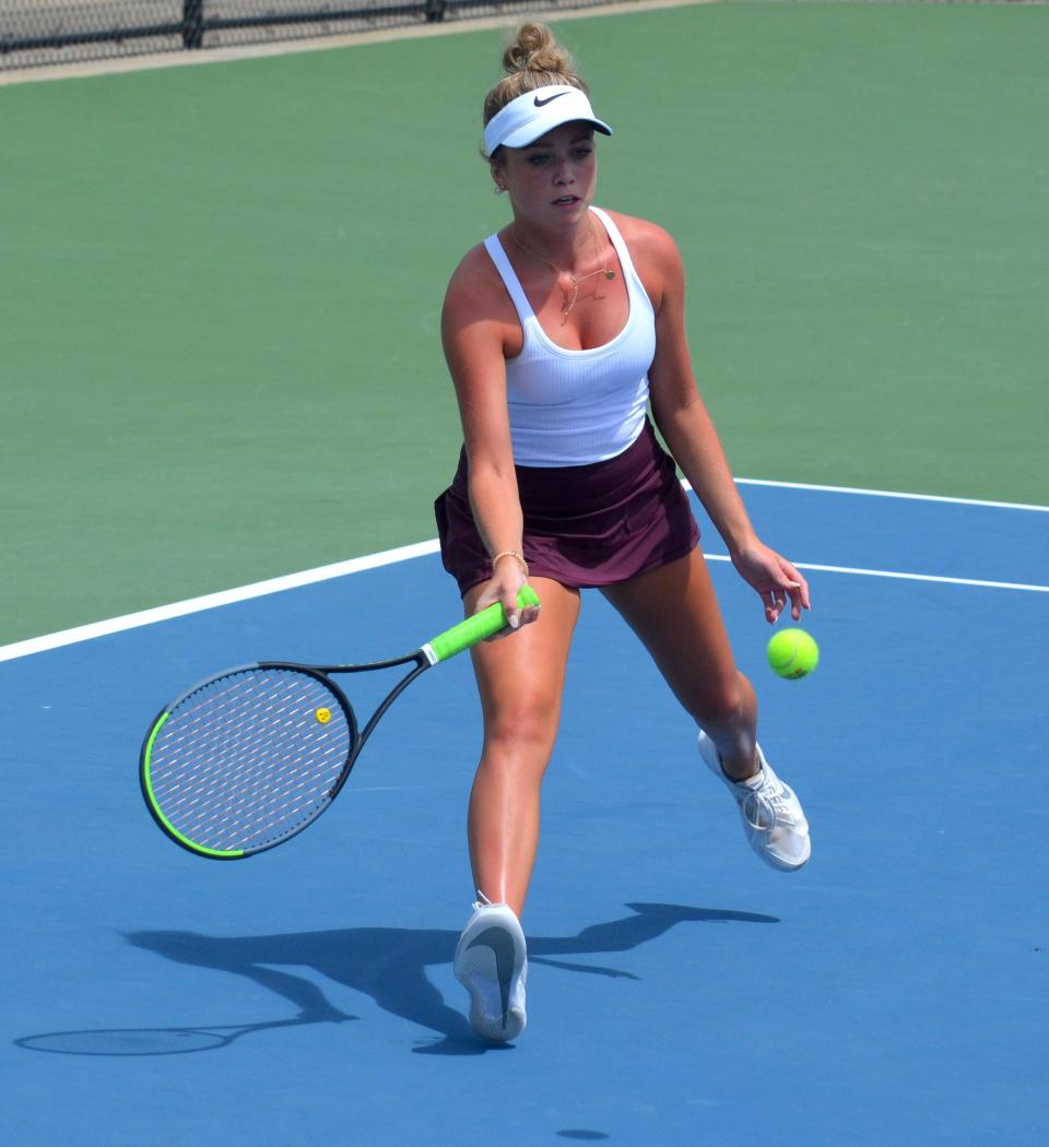 Holland Christian's Hope Rhoades returns a shot during the OK Blue Conference finals on Friday at Holland Christian.