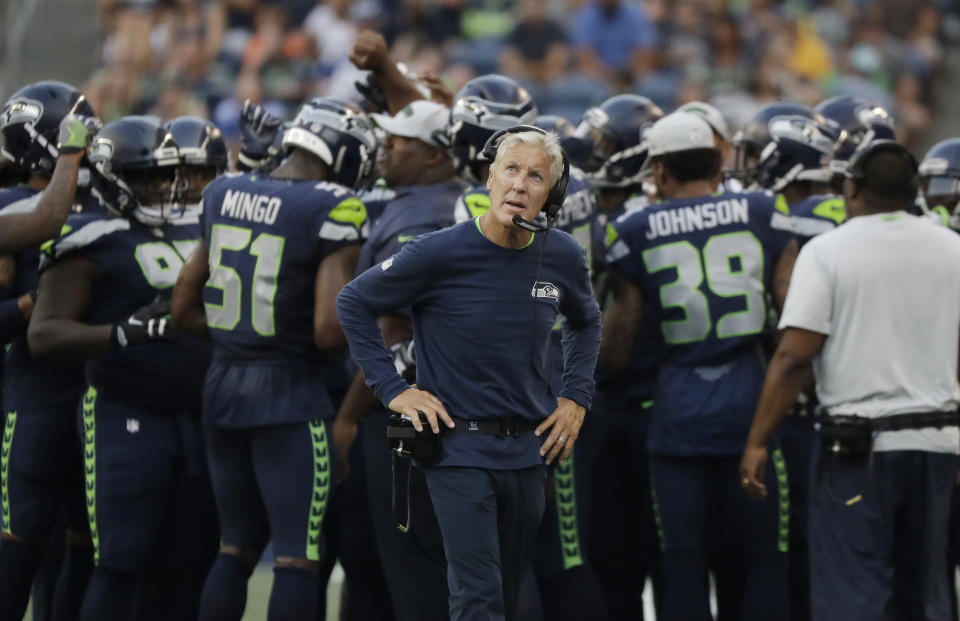Seattle Seahawks head coach Pete Carroll looks toward the scoreboard during the first half of an NFL football preseason game against the Indianapolis Colts, Thursday, Aug. 9, 2018, in Seattle. (AP Photo/Elaine Thompson)