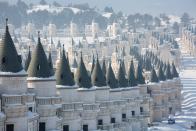 Veiled in a light layer of crisp white snow, Burj Al Babas takes on a more fairy-tale-like appearance.