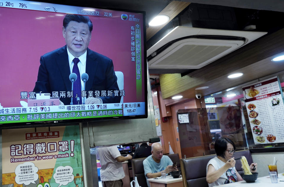 A TV screens broadcasts Chinese President Xi Jinping during an event to commemorate the 40th anniversary of the establishment of the Shenzhen Special Economic Zone in Shenzhen in southern China's Guangdogn Province at a restaurant in Hong Kong, Wednesday, Oct. 14, 2020. Xi promised Wednesday new steps to back development of China's biggest tech center, Shenzhen, amid a feud with Washington that has disrupted access to U.S. technology and is fueling ambitions to create Chinese providers. (AP Photo/Vincent Yu)