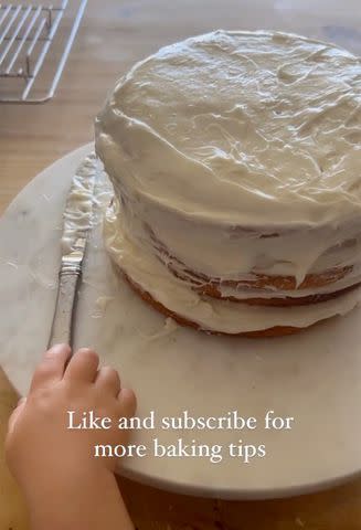 <p>Olivia Munn/Instagram</p> Munn shared a clip of son Malcom trying to get near Mulaney's birthday cake