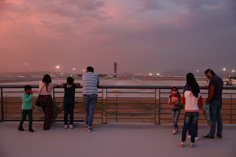 People look at the landing strip from an area of the new Felipe Angeles international airport, in Zumpango