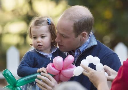 The Duke of Cambridge holds his daughter Princess Charlotte during a children's party at Government House in Victoria, British Columbia, Canada September 29, 2016. REUTERS/Jonathan Hayward/Pool