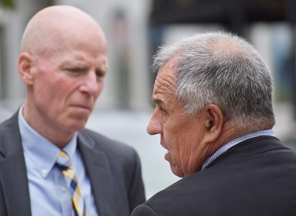 District Attornet Thomas Quinn speaks with Bristol County Assistant District Attorney William McCauley after sentencing.