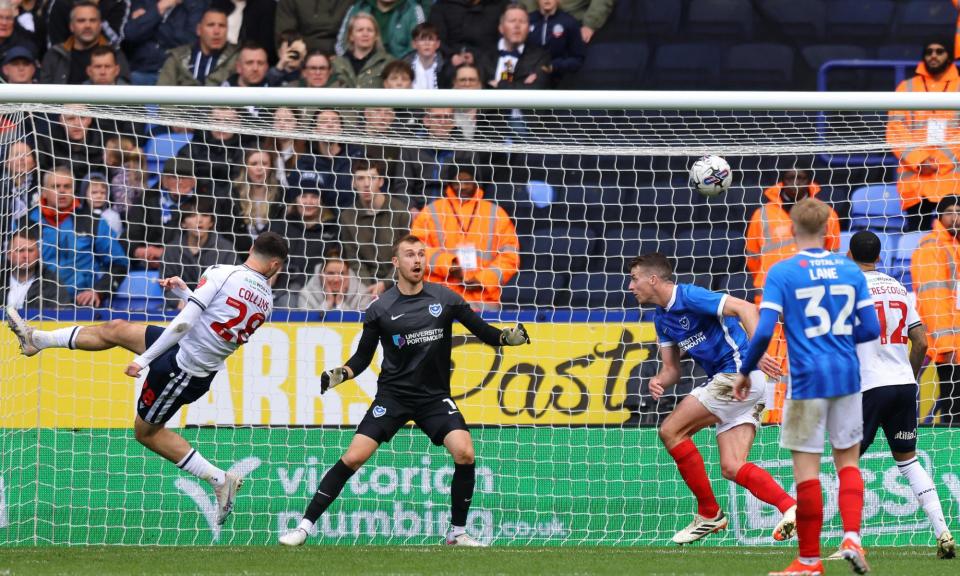 <span>Aaron Collins equalises for Bolton against Portsmouth in League One.</span><span>Photograph: Gary Oakley/Getty Images</span>