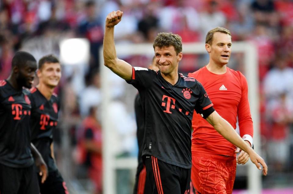 Thomas Müller acknowledges fans after the match.