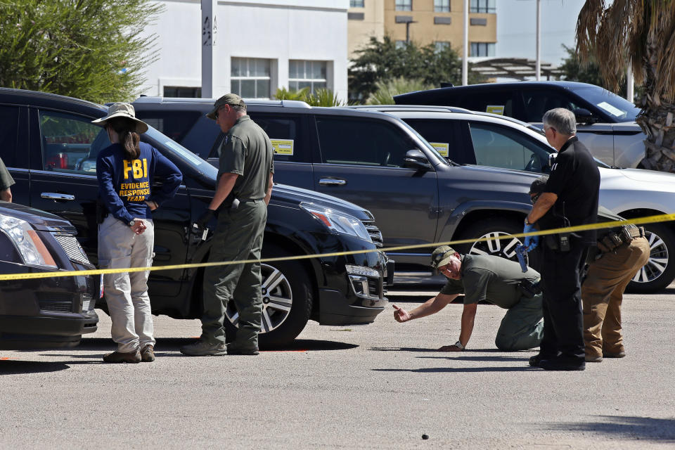 Officials continue to work the scene, Monday, Sept. 2, 2019, in Odessa, Texas, where teenager Leilah Hernandez was fatally shot at a car dealership during Saturday's shooting rampage. (AP Photo/Sue Ogrocki)