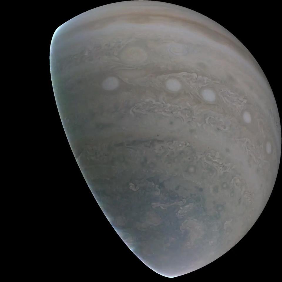 A half-sphere rendering of Jupiter against the darkness of space.