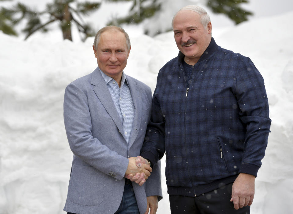 Russian President Vladimir Putin, left, and Belarusian President Alexander Lukashenko pose for a photo during their meeting in the Black Sea resort of Sochi, Russia, Monday, Feb. 22, 2021. (Alexei Druzhinin, Sputnik, Kremlin Pool Photo via AP)