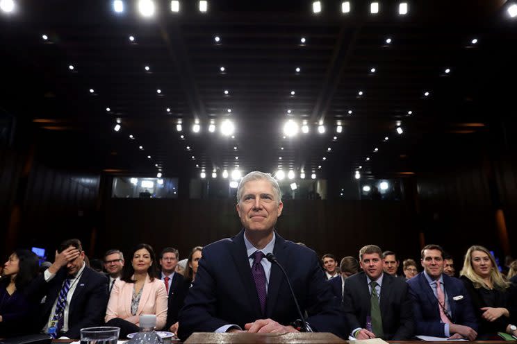 Judge Neil Gorsuch smiles as he prepares to testify during his Supreme Court confirmation hearing.