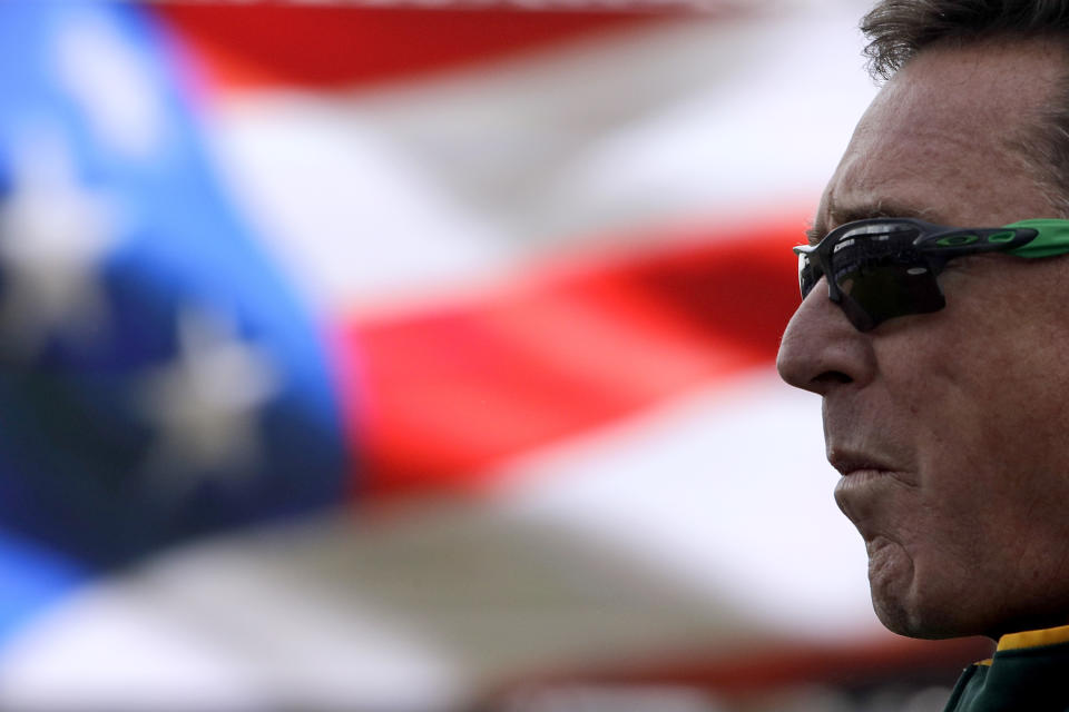 Oakland Athletics manager Bob Melvin stands during the national anthem before a spring training baseball game against the Seattle Mariners, Friday, Feb. 22, 2019, in Peoria, Ariz. (AP Photo/Charlie Riedel)