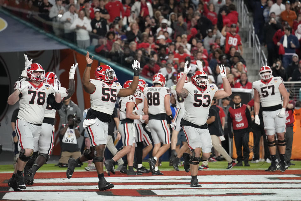Georgia players celebrate a touchdown by Georgia tight end Lawson Luckie in the second half of the Orange Bowl NCAA college football game against Florida State, Saturday, Dec. 30, 2023, in Miami Gardens, Fla. (AP Photo/Rebecca Blackwell)