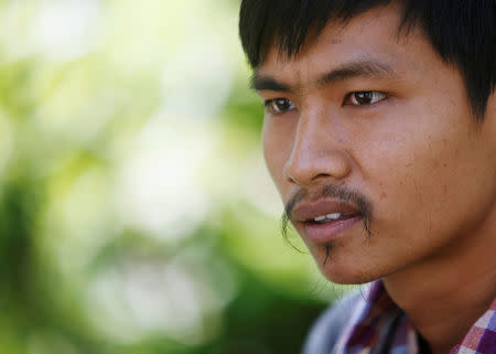 Ma Chetra 28, who runs the Social Breaking News (SBN) Pro-CNRP Facebook page, looks at during an interview with Reuters in Phnom Penh, Cambodia, July 3, 2018. Picture taken on July 3, 2018. REUTERS/Samrang Pring