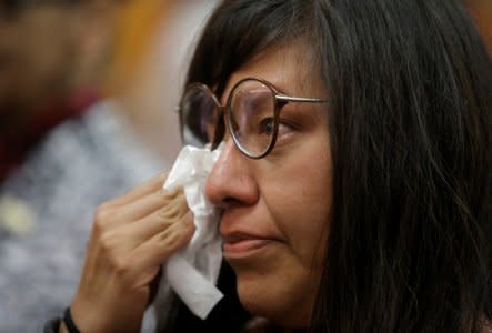 Norma Jimenez, a victim of the 2006 land conflict in San Salvador Atenco in Mexico, dries her tears after her hearing was convened by the judges of the Inter-American Court of Human Rights in San Jose, Costa Rica November 16, 2017. REUTERS/Juan Carlos Ulate