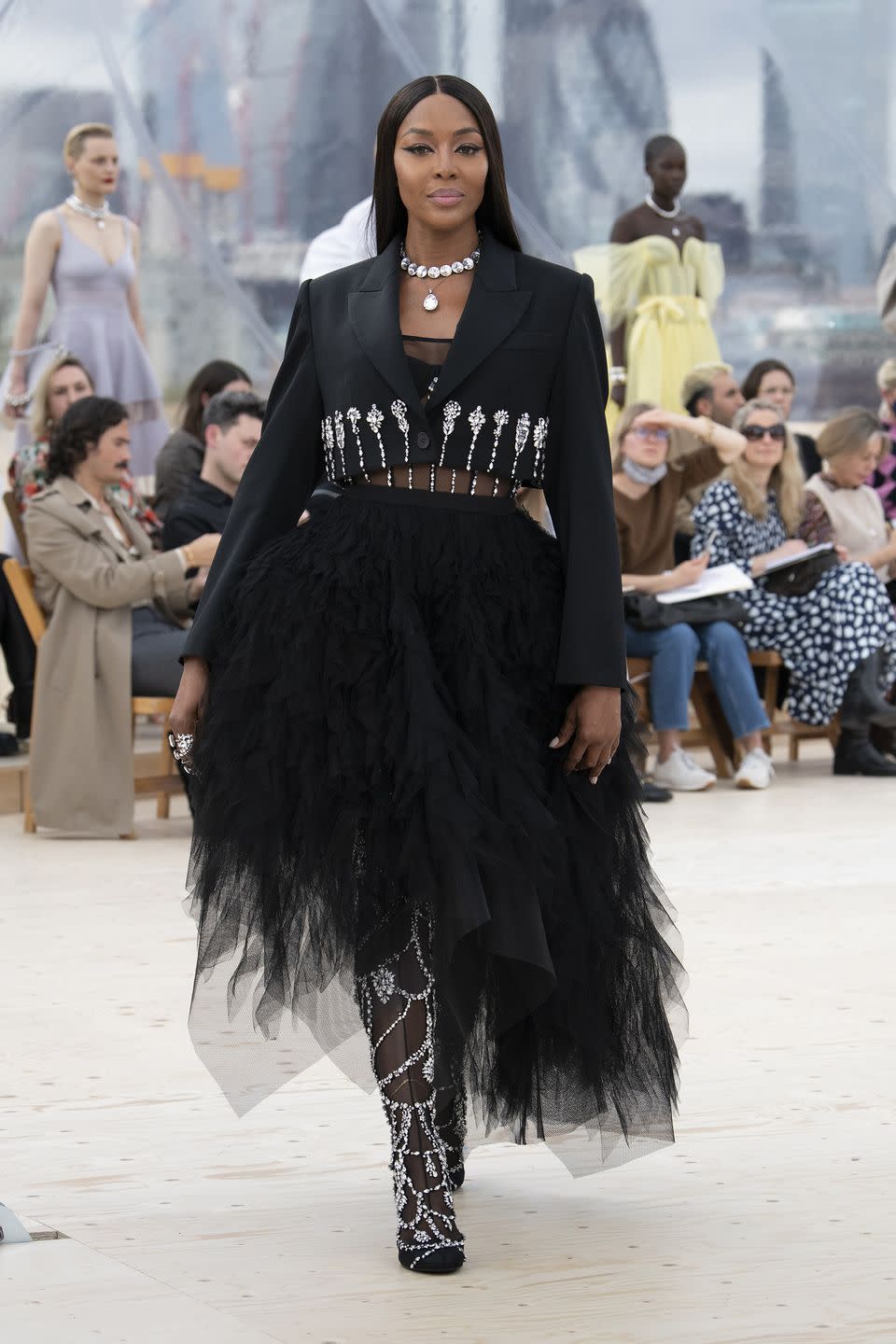 <p>Naomi Campbell closed the spring/summer 2022 Alexander McQueen show, marking the first time the British brand has shown in London for five years. Titled ‘London Skies’, the catwalk event was held in a specially constructed dome overlooking the city skyline.</p><p>“I’m interested in immersing myself in the environment in which we live and work in London, and in the elements as we experience them each day,” said creative director Sarah Burton.</p><p>The elements were depicted throughout the collection, from dreamlike cloud prints, to clothes inspired by the unpredictability of storm chasing, and variations on the glittering night sky. </p>