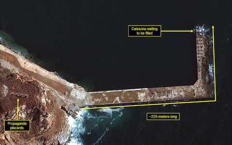 Construction of L-shaped pier continues - Credit: DigitalGlobe/ScapeWare3d